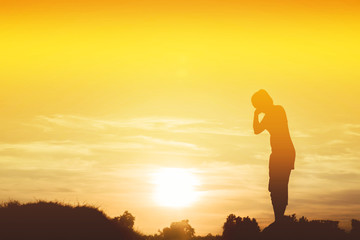 Silhouette of woman So happy at sunset