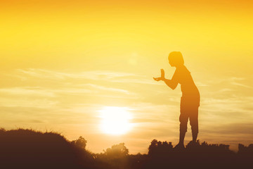 Obraz na płótnie Canvas Silhouette of woman So happy at sunset