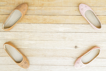 Female shoes on wood background