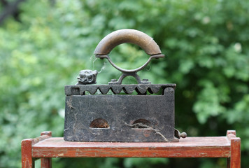 Retro iron on wooden stand