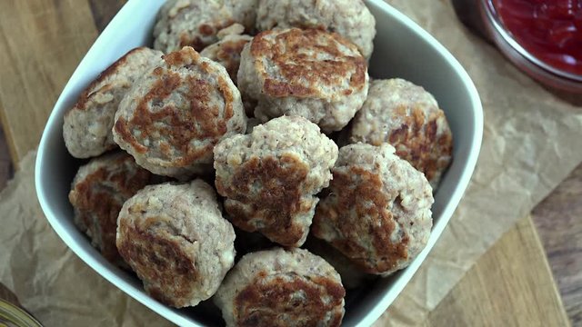 Rotating Mini Burgers (fresh made, seamless loopable 4K UHD footage)