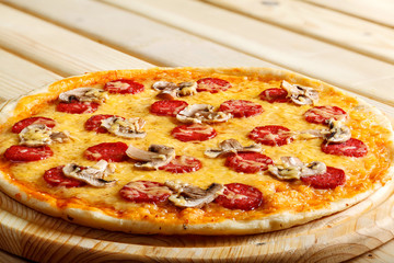 Delicious italian pizzas served on wooden table