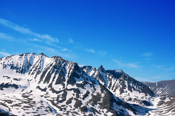 Fototapeta na wymiar mountains with snow and blue sky