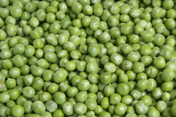 fresh green peas background texture top view, full frame.