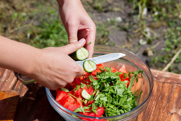 fresh vegetable salad in a plate on a wooden table