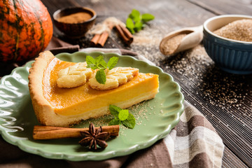 Traditional American pumpkin pie with cinnamon and mint