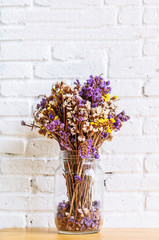 Dried flowers in bottle, Glass bottle is reused to decorate and