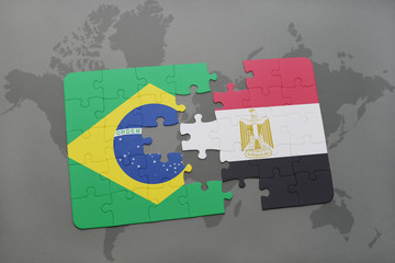 puzzle with the national flag of brazil and egypt on a world map background.
