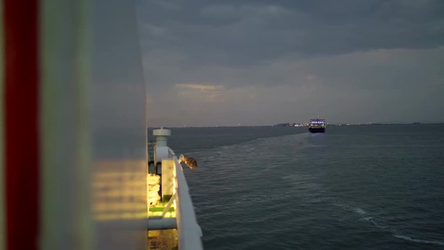 View from vessel board on the cargo passenger ferry boat Glykofilousa III crossing Kerch Strait in the early morning 