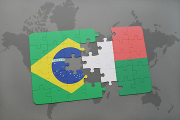 puzzle with the national flag of brazil and madagascar on a world map background.