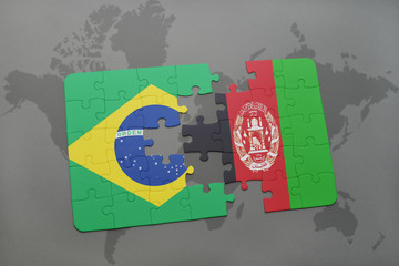 puzzle with the national flag of brazil and afghanistan on a world map background.