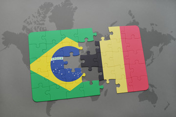 puzzle with the national flag of brazil and belgium on a world map background.