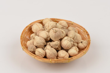 Siam Cardamom, Best Cardamom, Clustered Cardamom, Camphor Seed (Amomum krervanh Pierre)., The medicinal properties of spices in the basket on a white background