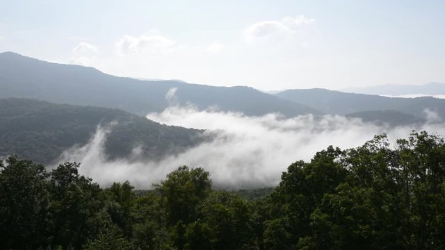 Clouds and Fog rolling over a mountain range in Asheville, North Carolina