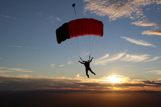 Skydiver in sunset