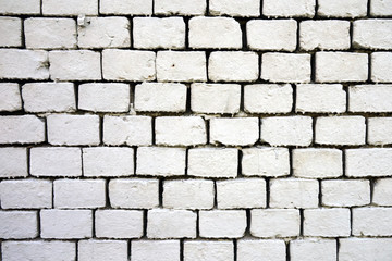 Obraz premium Old wall of bricks painted white.