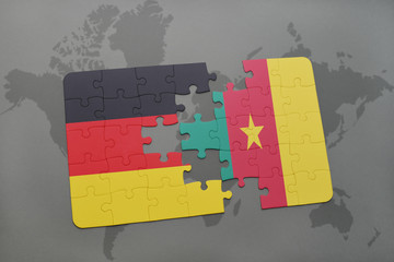 puzzle with the national flag of germany and cameroon on a world map background.