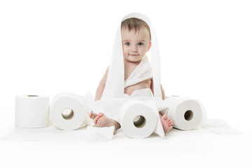 Toddler ripping up toilet paper in bathroom studio