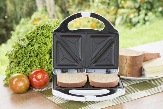 Open Sandwich Toaster with ingredients in a kitchen setting