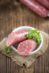 German Mettwurst on wooden background