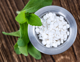 Stevia sweetener on wooden background