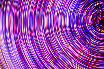 Abstract rotating neon lights texture.