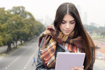 Portrait of a young woman using her tablet.