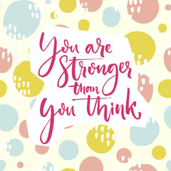 You are stronger than you think. Motivation quote lettering on playful green and pink hand drawn circles background