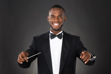 Portrait Of Music Conductor With Baton