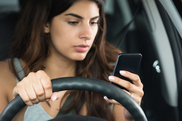 Woman Inside Car Holding Mobile Phone
