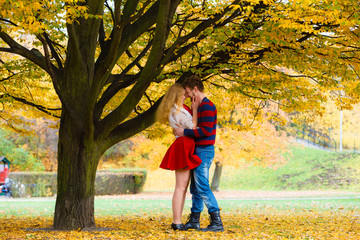 Young couple meet in park on date.