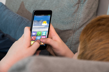 Boy Using Mobile Phone