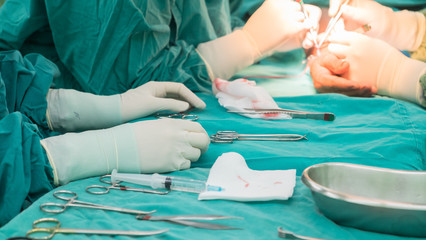 Nurses prepare surgical instruments