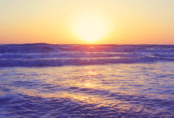 Fototapeta na wymiar Abstract ocean seascape waves evening sunset sunrise vintage filter