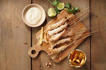 crumbed prawn skewers with potato fries