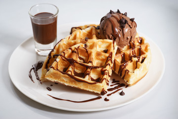 waffles with chocolate ice cream and chocolate sauce