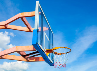 Basketball hoop on a blue sky