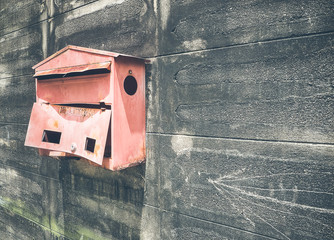Old steel red mailbox hang on the wall, With place your text