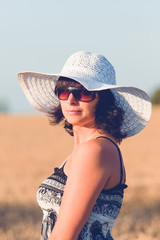 Middle aged beauty woman in wheat field