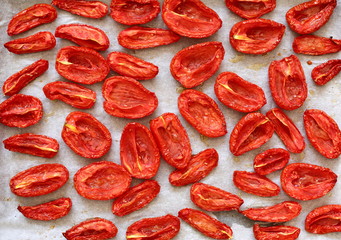 Sun dried tomatoes on white parchment