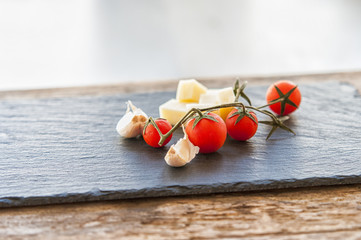 Italian cheese with tomato and garlic