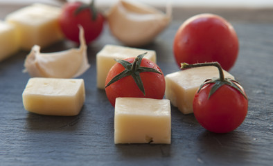 Italian cheese with tomato and garlic