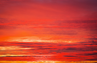 Fototapeta na wymiar Beautiful fiery orange and red apocalyptic sunset sky.
