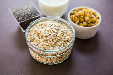 oats in wooden bowl and muesli ingredients