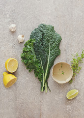 Kale salad with garlic and lemon vinaigrette. Ingredients for cooking