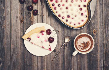 Retro styled vintage background. Slice of homemade cherry pie 