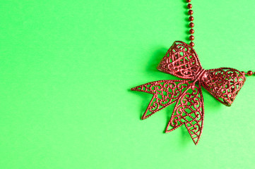 Red bow isolated on a green background