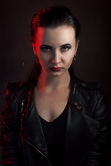 girl in a black leather jacket, the image of  vampire on Halloween,