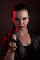 girl in a black leather jacket, the image of vampire on Halloween,