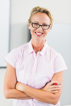 Portrait of teacher smiling in classroom